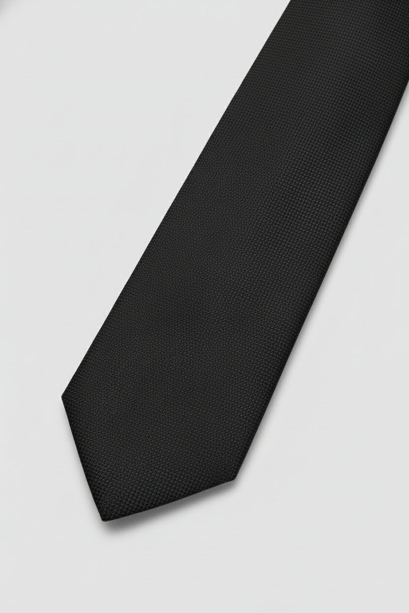 Navy textured silk tie with a classic design, perfect for formal occasions.