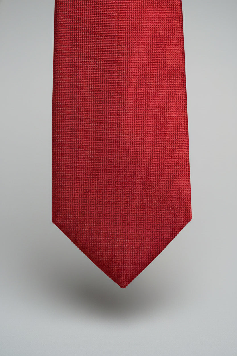 Red textured silk tie perfect for formal events and business attire.
