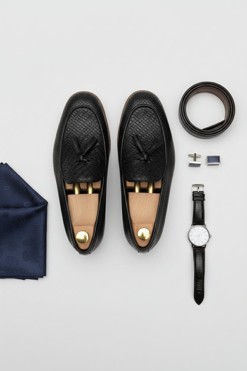 Black textured woven loafers with elegant design, perfect for casual or formal wear.