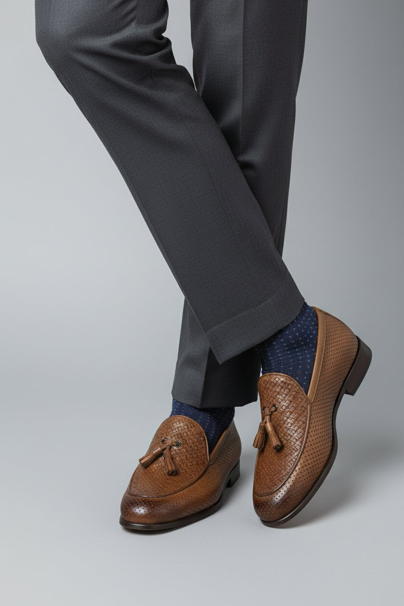 Brown woven leather loafers with tassels, perfect for casual and formal wear.