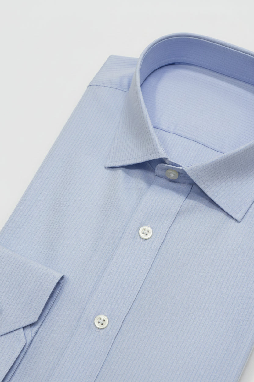 Light blue striped slim fit dress shirt with textured fabric and tailored collar.