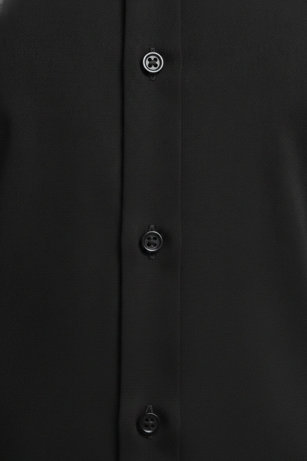 Man wearing jet black formal tailored shirt - Suit Sartoria UAE