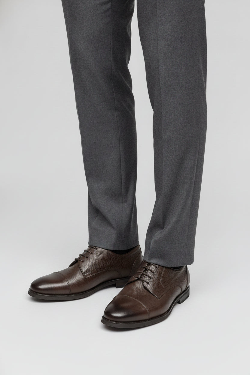 Man wearing dark brown leather Derby shoes - Suit Sartoria UAE