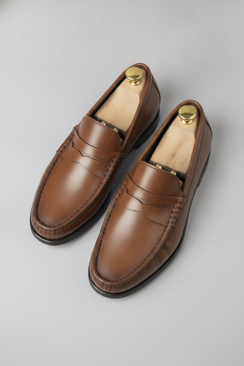 Chestnut brown penny loafers in leather - Suit Sartoria UAE