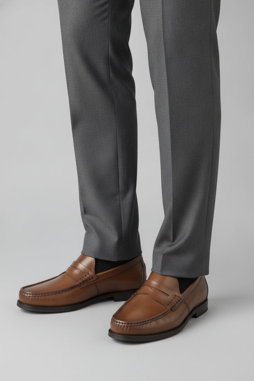 Man wearing chestnut brown leather penny loafers - Suit Sartoria UAE