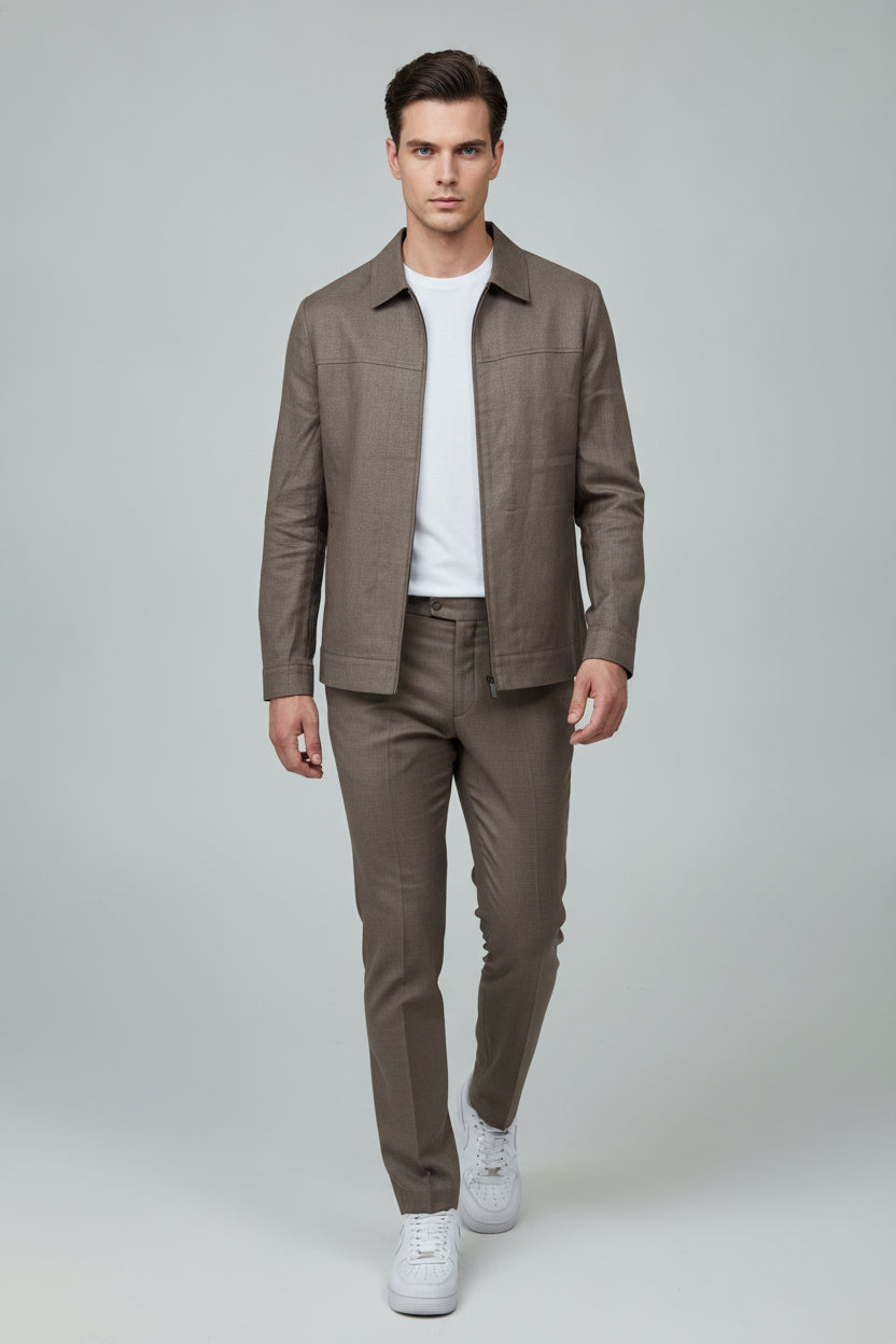 Man wearing taupe zip-front safari suit, classic collar - Suit Sartoria UAE