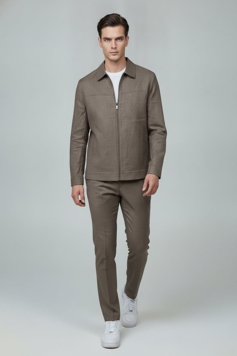 Man wearing taupe zip-front safari suit - Suit Sartoria UAE