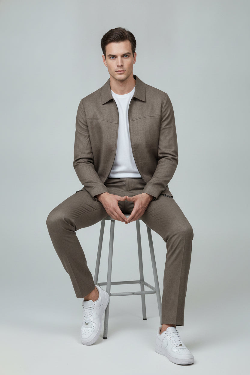 Man wearing taupe zip-front safari suit with classic collar - Suit Sartoria UAE